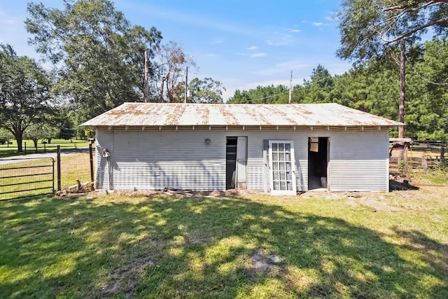 view of outbuilding with an outbuilding and fence