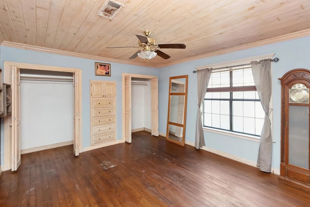 unfurnished bedroom with wood ceiling, visible vents, ornamental molding, dark wood-style floors, and two closets