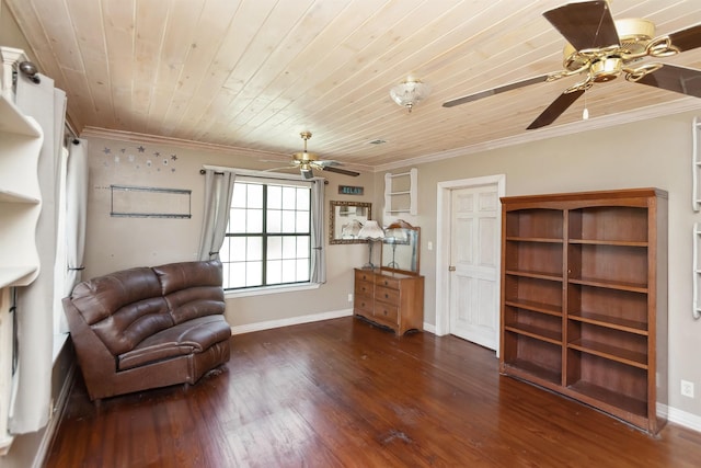 sitting room featuring baseboards, dark wood-style flooring, wooden ceiling, and crown molding