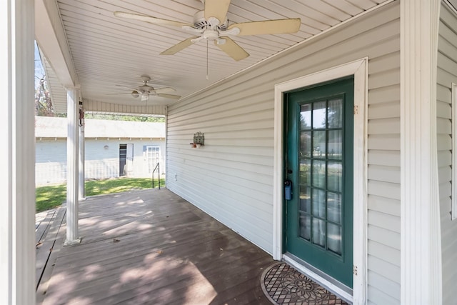 exterior space featuring ceiling fan and a porch