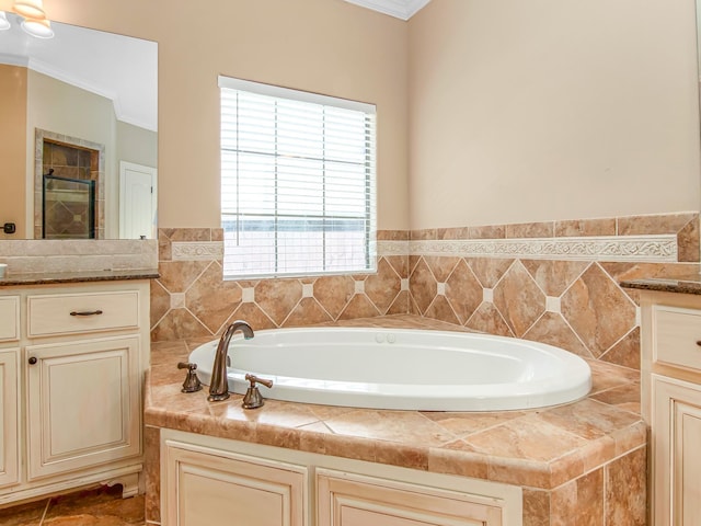 bathroom featuring vanity, independent shower and bath, and ornamental molding