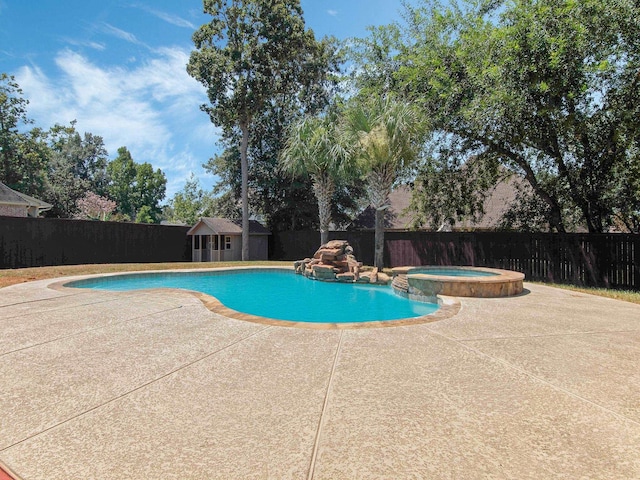 view of swimming pool with an in ground hot tub and a patio