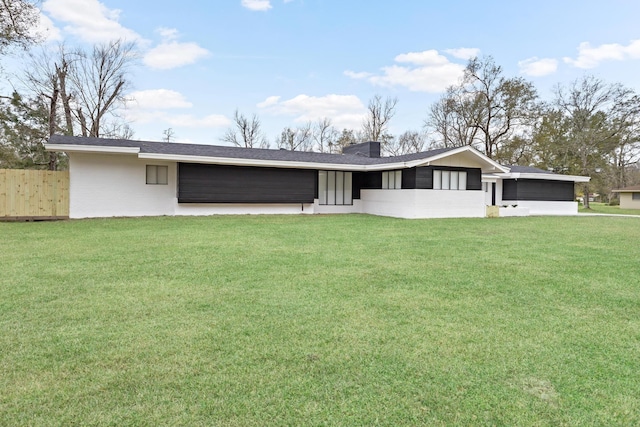 back of house with a yard