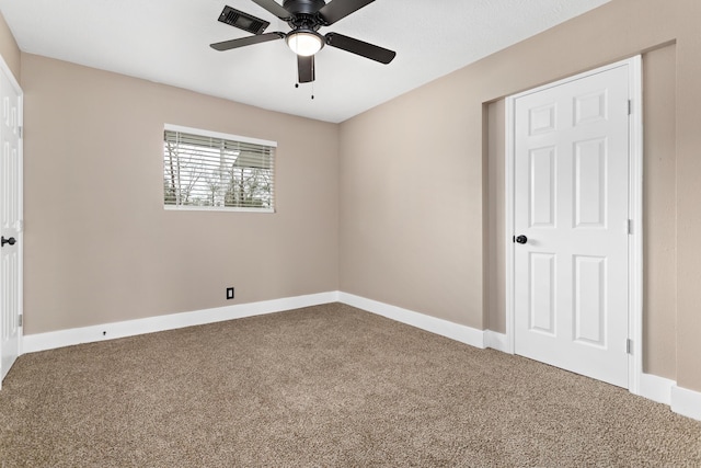 unfurnished bedroom with ceiling fan and carpet floors