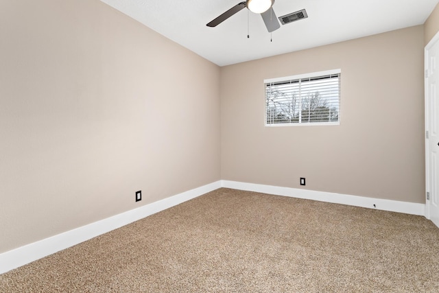 unfurnished room featuring ceiling fan and carpet floors