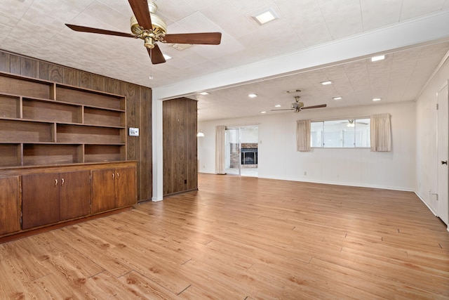 unfurnished living room featuring ceiling fan, light wood finished floors, and recessed lighting