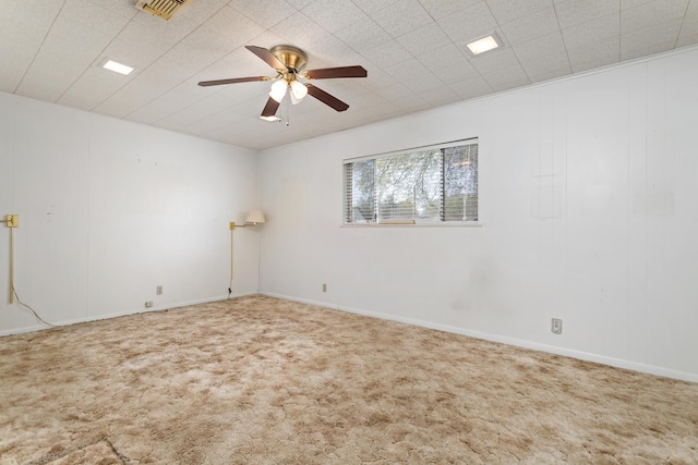 empty room with carpet and ceiling fan