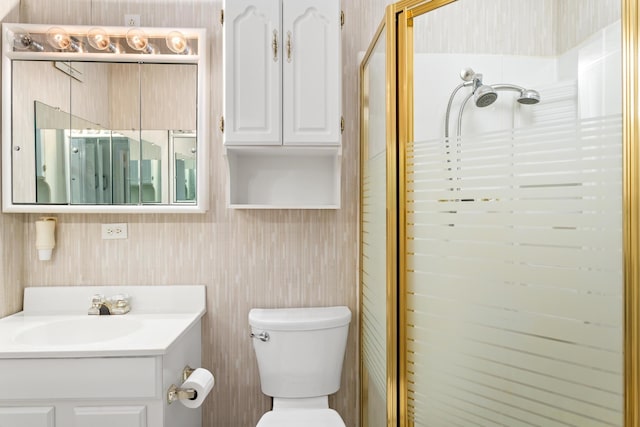 full bath featuring wallpapered walls, a stall shower, toilet, and vanity