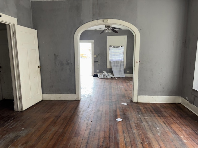 2726 13th St, Port Arthur, TX 77640 - spare room featuring arched walkways, wood-type flooring, and a ceiling fan