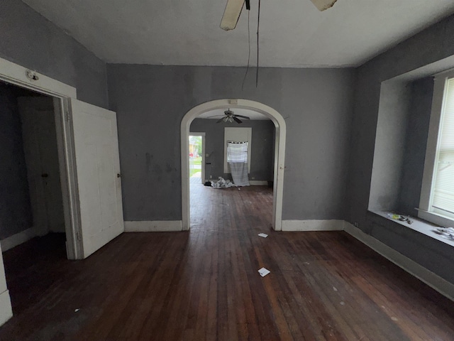 2726 13th St, Port Arthur, TX 77640 - unfurnished dining area featuring a ceiling fan, arched walkways, wood finished floors, and healthy amount of natural light