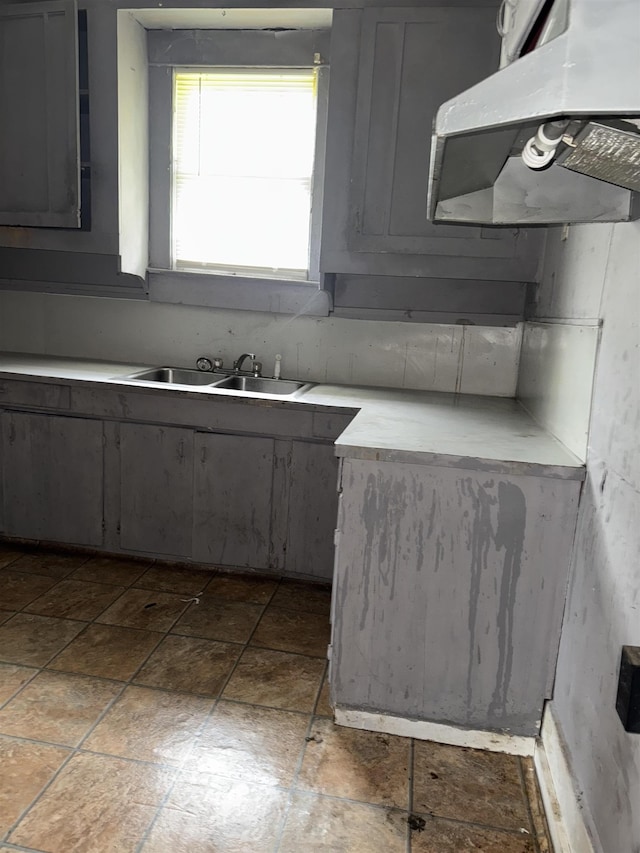2726 13th St, Port Arthur, TX 77640 - kitchen featuring ventilation hood, light countertops, and gray cabinets