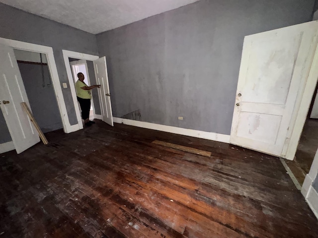 2726 13th St, Port Arthur, TX 77640 - unfurnished bedroom with wood-type flooring and baseboards