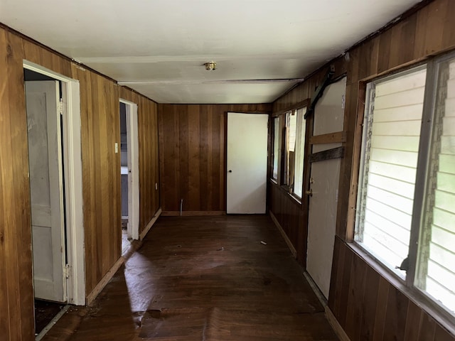 2726 13th St, Port Arthur, TX 77640 - hallway featuring wood walls and dark wood-type flooring