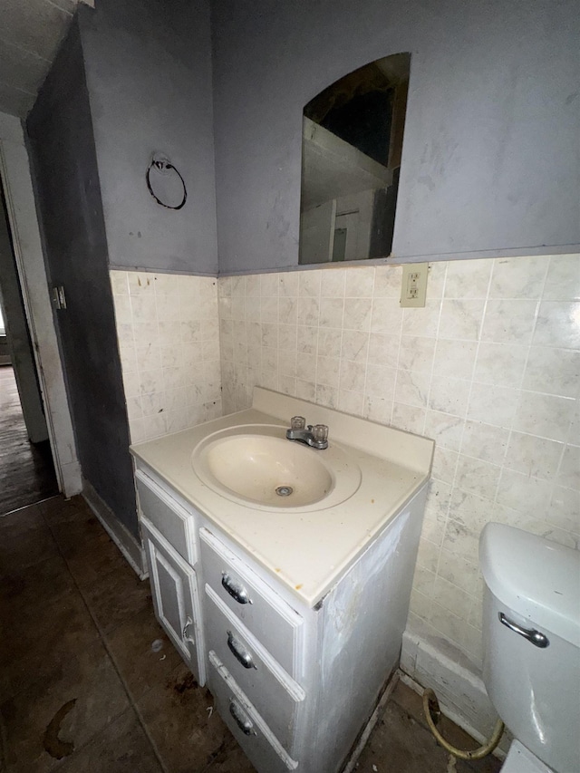 2726 13th St, Port Arthur, TX 77640 - bathroom with tile walls, vanity, wainscoting, and tile patterned floors