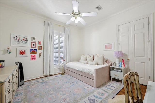 2175 Brewton Cir, Beaumont, TX 77706 - bedroom featuring light wood-type flooring, ornamental molding, and a ceiling fan