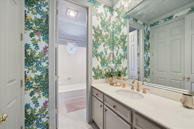 2175 Brewton Cir, Beaumont, TX 77706 - full bathroom with wallpapered walls, vanity, a bath, and tile patterned flooring
