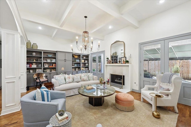 2175 Brewton Cir, Beaumont, TX 77706 - living area featuring wood finished floors, beam ceiling, a chandelier, french doors, and recessed lighting