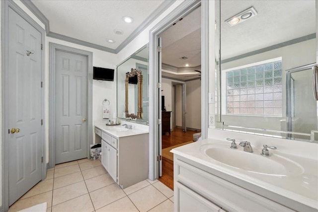 2175 Brewton Cir, Beaumont, TX 77706 - full bath featuring vanity, tile patterned flooring, ornamental molding, and a garden tub