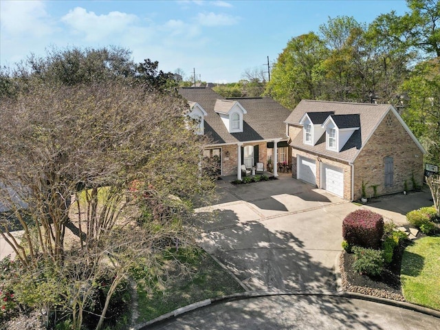 2175 Brewton Cir, Beaumont, TX 77706 - view of front of home with brick siding, concrete driveway, and a garage