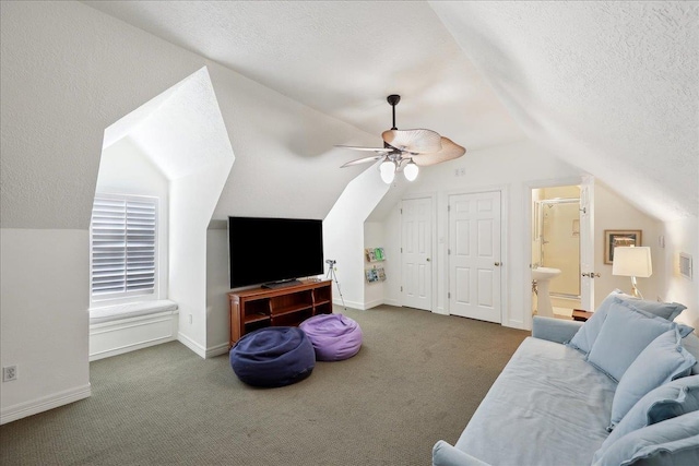 2175 Brewton Cir, Beaumont, TX 77706 - living area with a ceiling fan, lofted ceiling, carpet floors, a textured ceiling, and baseboards