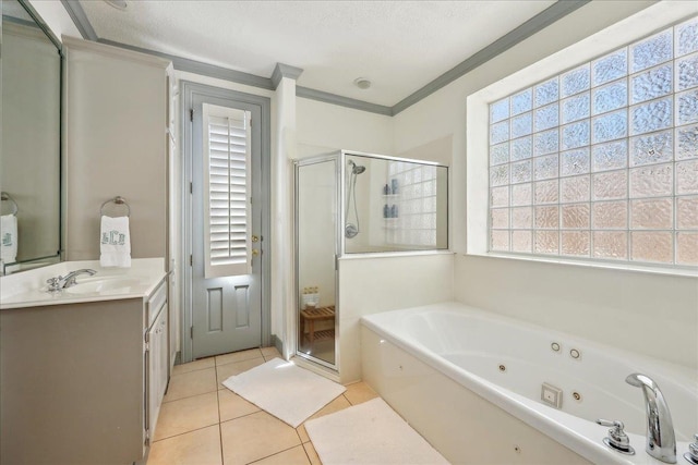 2175 Brewton Cir, Beaumont, TX 77706 - bathroom with crown molding, a stall shower, tile patterned flooring, a whirlpool tub, and vanity