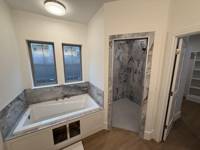 3547 Lily Ln, Beaumont, TX 77713 - bathroom featuring tiled shower and a bath