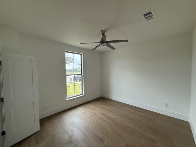 3547 Lily Ln, Beaumont, TX 77713 - empty room with ceiling fan, baseboards, and wood finished floors