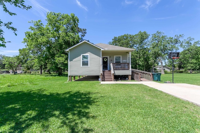 bungalow-style house with a porch, a front lawn, and stairs
