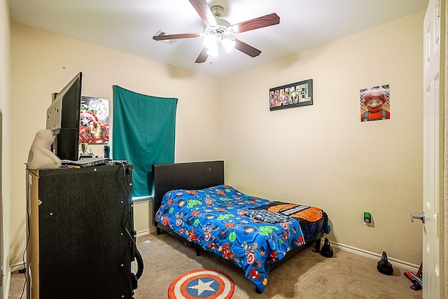 bedroom with carpet floors, baseboards, and ceiling fan