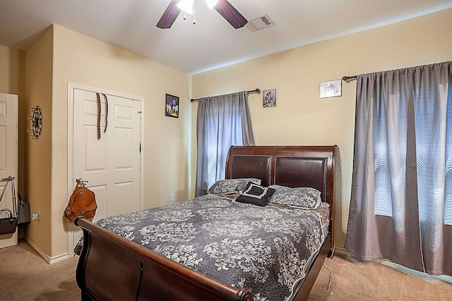 bedroom with light carpet, baseboards, and ceiling fan