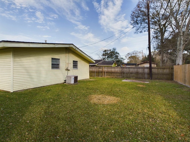 view of yard with central AC