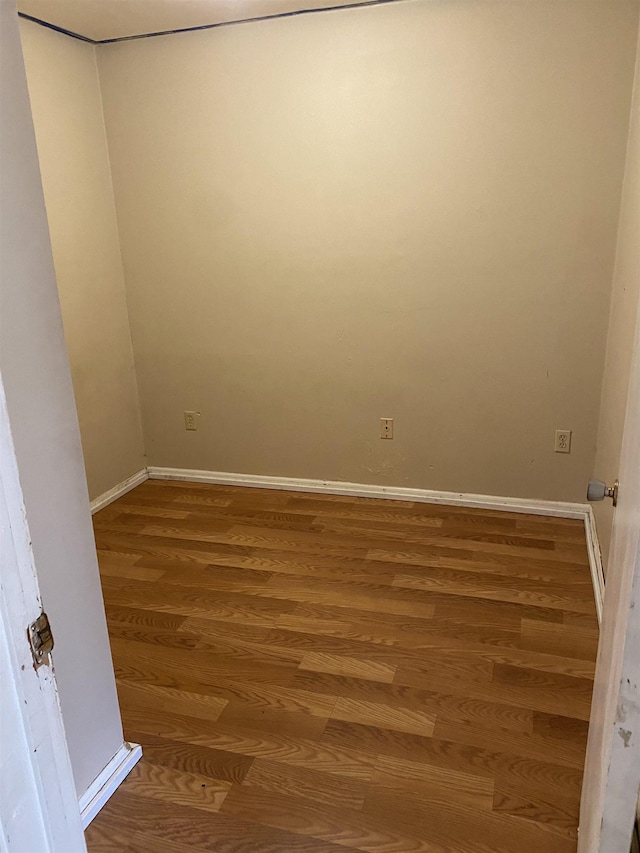 spare room featuring hardwood / wood-style floors