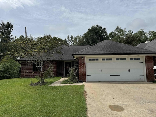 single story home with a garage and a front lawn