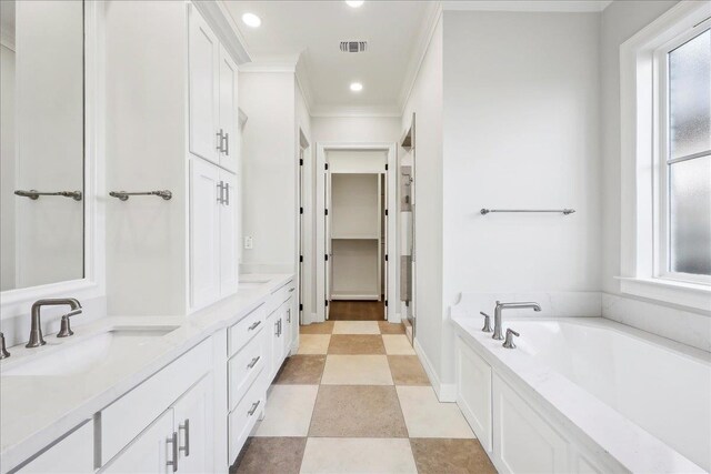 6588 Pointe Park, Beaumont, TX 77706 - bathroom with ornamental molding, a garden tub, double vanity, and recessed lighting