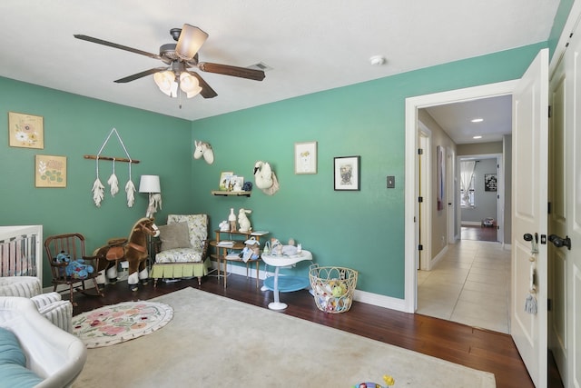 bedroom featuring hardwood / wood-style floors and ceiling fan