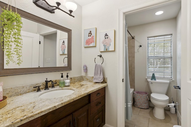 full bathroom featuring toilet, vanity, tile patterned floors, and tiled shower / bath