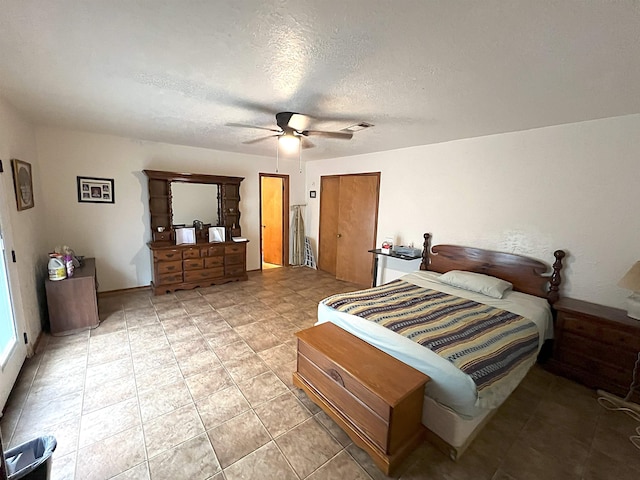 155 Hunters Ct, Lumberton, TX 77657 - bedroom featuring a textured ceiling, ceiling fan, and light tile patterned floors