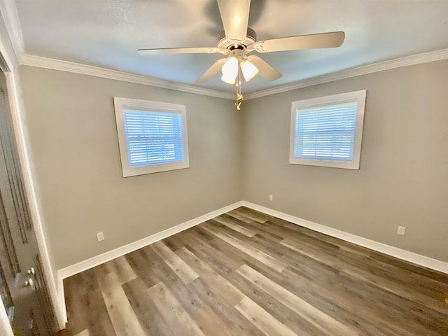 3900 Lakeview Cutoff, Vidor, TX 77662 - spare room featuring plenty of natural light, baseboards, wood finished floors, and crown molding