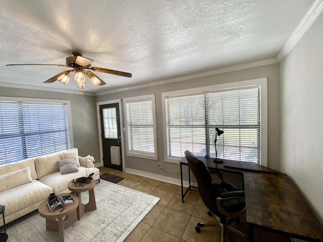 office area featuring a ceiling fan, a textured ceiling, light tile patterned floors, baseboards, and ornamental molding