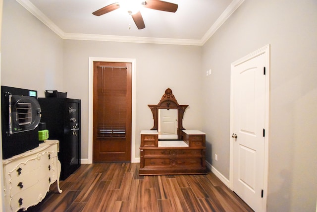 interior space with ceiling fan, crown molding, and dark wood-type flooring