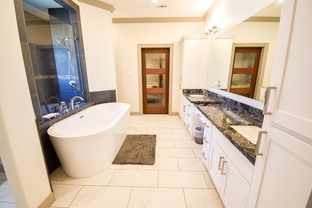 bathroom featuring tile patterned floors, vanity, shower with separate bathtub, and crown molding