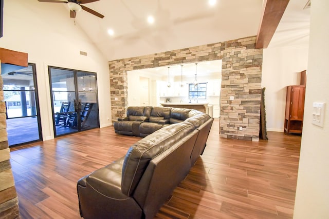 living room featuring ceiling fan, wood-type flooring, and high vaulted ceiling