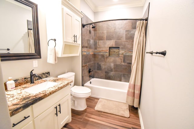 full bathroom with ornamental molding, vanity, hardwood / wood-style flooring, shower / bathtub combination with curtain, and toilet