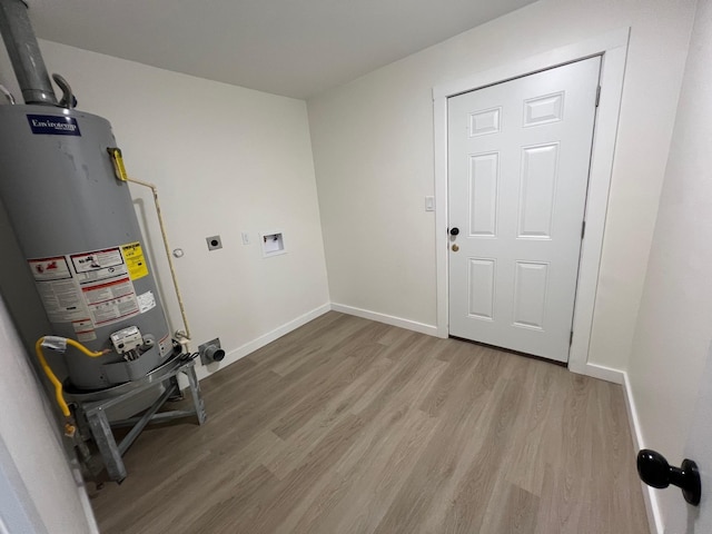 laundry room with washer hookup, light wood-type flooring, gas water heater, and hookup for an electric dryer