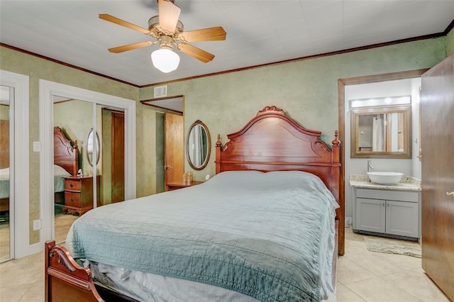 tiled bedroom with ceiling fan, sink, and crown molding