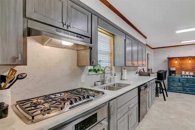 kitchen featuring dishwasher, sink, ornamental molding, wall oven, and stainless steel gas cooktop