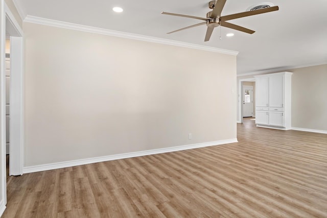 empty room featuring ceiling fan, light wood-type flooring, and ornamental molding