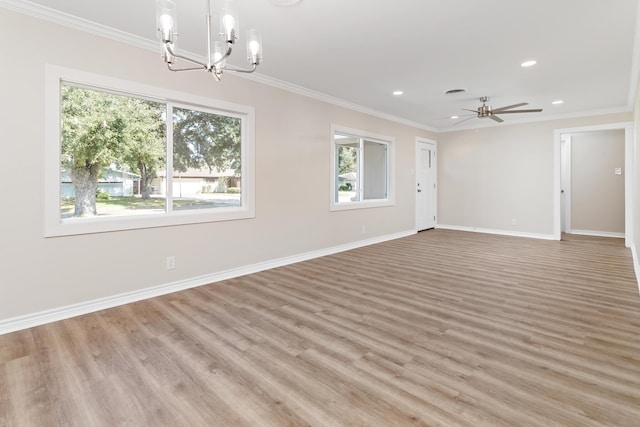 spare room with ceiling fan with notable chandelier, light wood-type flooring, and ornamental molding