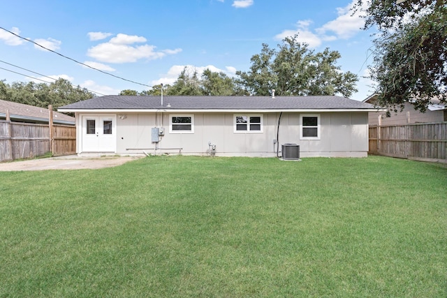 back of house with a patio, central AC, and a lawn