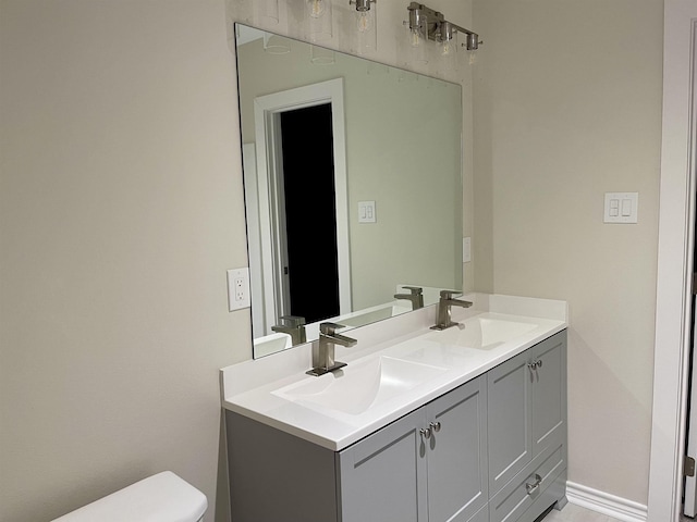 bathroom with vanity and toilet